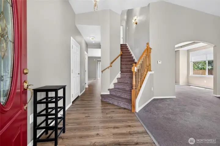 Main Foyer Entry, notice the Brand New Durable Laminate Floors that continue in to the Kitchen.