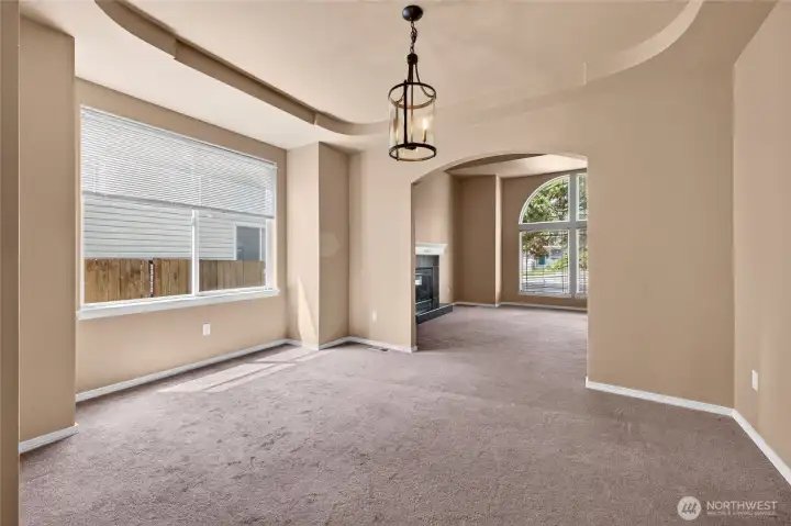 Beautiful Formal Dining Room with Decorative Recessed Ceiling, located perfectly between the Chef's Kitchen and Living Room.
