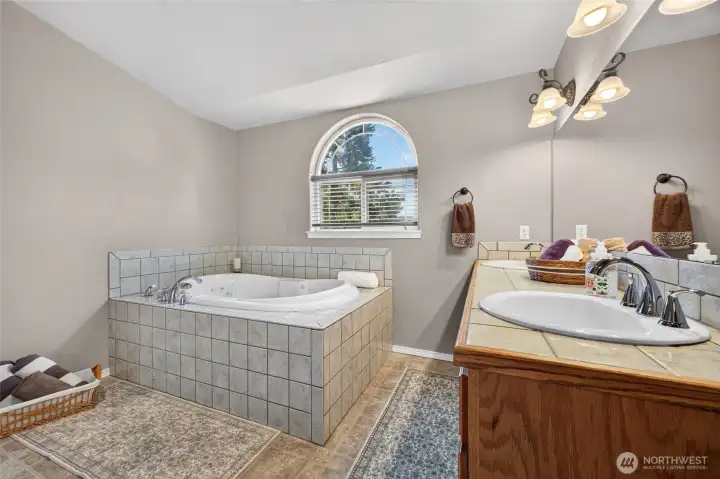 Primary Bath has Dual Vanities, Spa Jetted Tub, Large Shower and Dual Vanities.