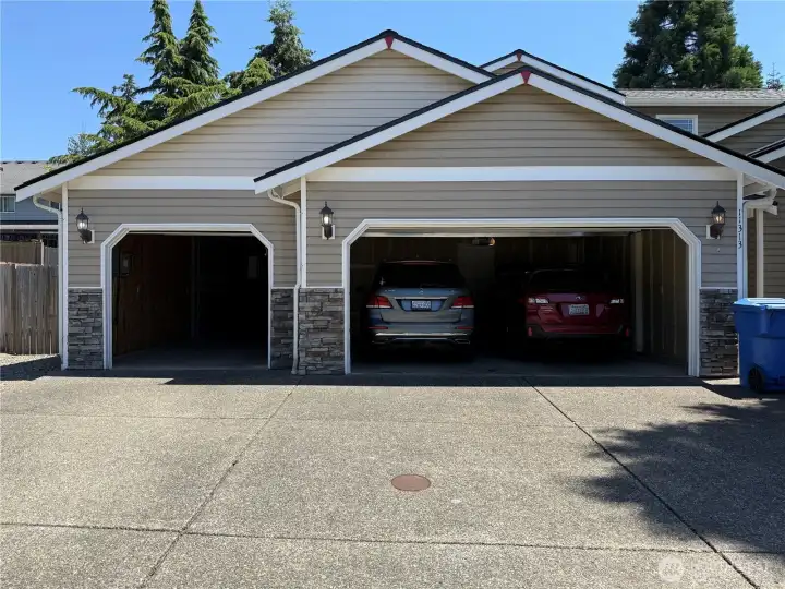 View of Cars in the 4 Car  Garage. The Single Bay is a Deep Tandem.