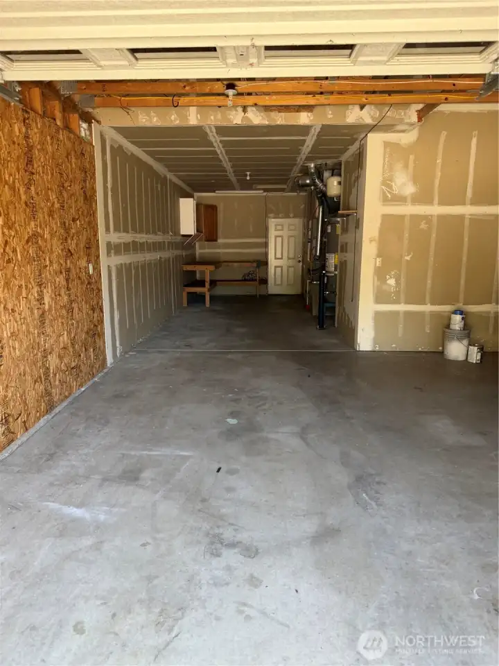 View of 3RD Bay to show the Depth and Work Bench in the back. The Den Flex Room is on the other side. This area could easily be changed into a Grand Main Floor Suite.