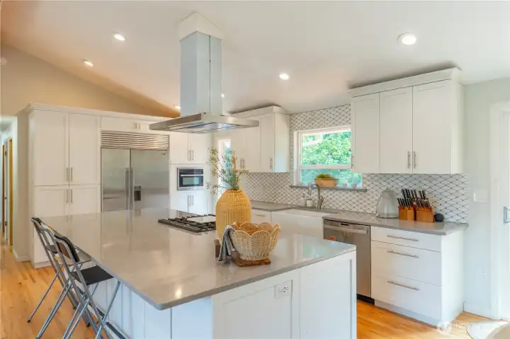 Remodeled Kitchen with ample storage including 4 deep storage cabinets on bar side.