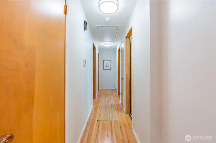 Hallway leads to 3 bedrooms and full bath on main floor.