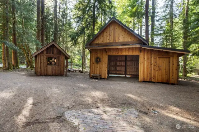 Detached storage shed, and carport with side storage room/work shop plus upper attic dry storage (access at the back of carport).