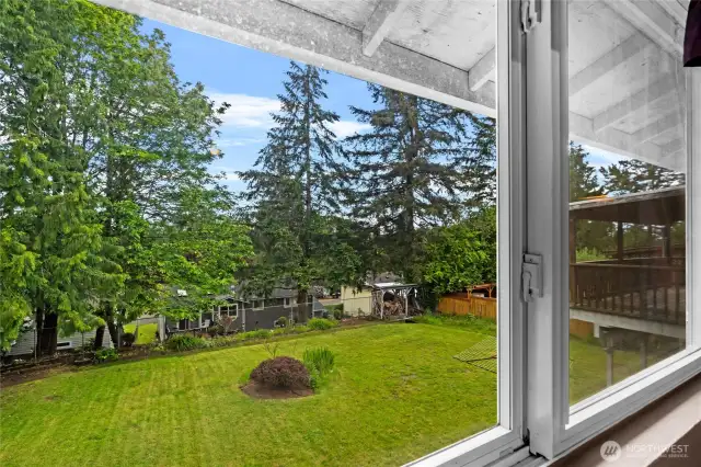 View of the Large Level Back Yard from the Primary Bedroom