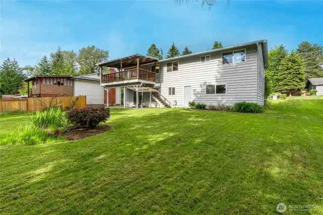 8925 sqft lot with Big Fenced Back Yard. Covered Deck and Patio off the Back