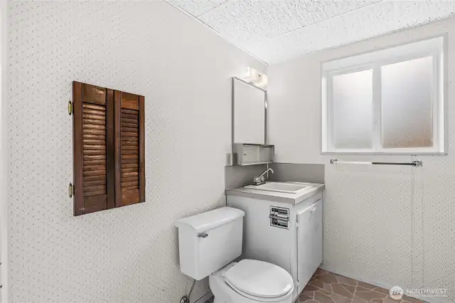 Lower Level 1/2 Bath Between the Garage and Rec Room