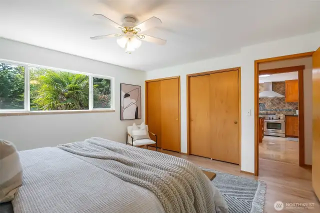 Primary bedroom with double closet.