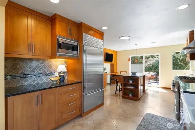 South facing, sunny kitchen opens onto large back deck.