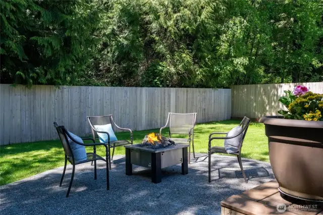 Tranquil Backyard Retreat with Fire Pit    Enjoy the perfect blend of privacy and relaxation in this beautifully maintained backyard oasis.