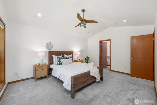 The suite includes a spacious walk-in closet and direct access to a luxurious ensuite bathroom.