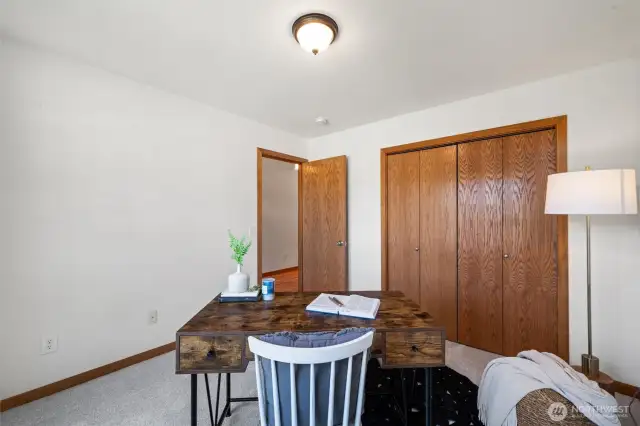 The Guest bedrooms are located on the opposite side of the home from the Primary suite with a full bathroom between, linen storage, tile shower tub surround and new carpets.