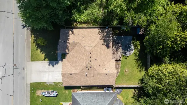 Well-maintained landscaping and tasteful architectural details set the tone for the comfort and elegance found throughout the rest of the property.