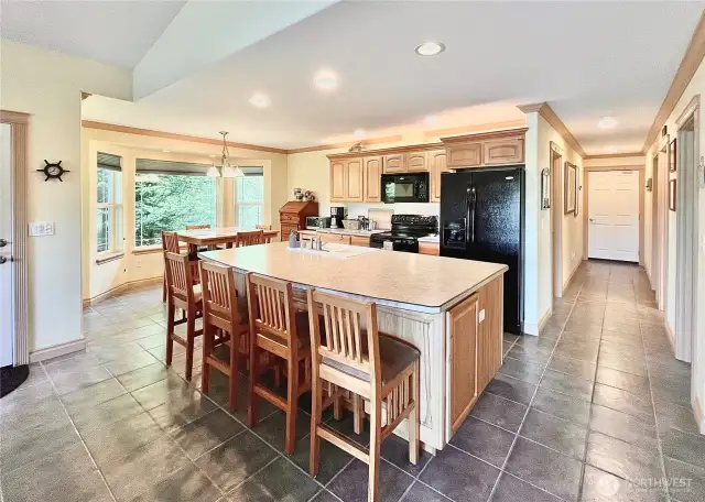 Spacious and Stylish Kitchen, Designed with   Entertaining in Mind. Ample Counter Space   Provides the Perfect Setup for Hosting   Friends, Whether It’s Game Day or a Casual   Gathering. The Kitchen Features a Bar   Captain's Cabinet, Beautifully Crafted   Cabinets, and an Open Layout that Creates a   Welcoming Atmosphere for All