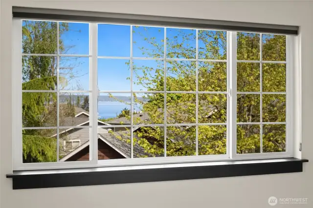 Blue skies, green treetops, and glimmers of water—this is the view you’ll love coming home to.