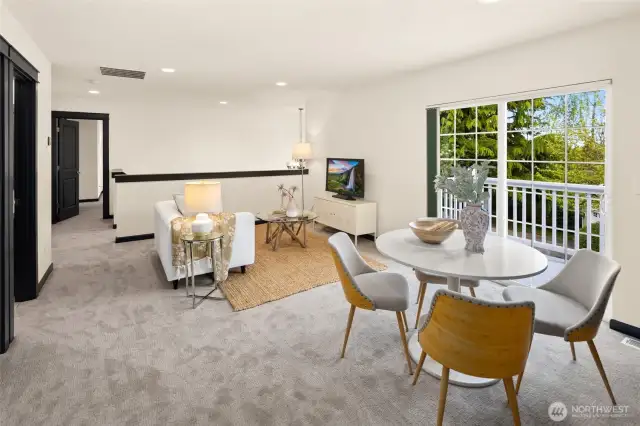 This generous bonus area offers flexible options—game nights, study sessions, or quiet reading—with direct access to the upstairs balcony.