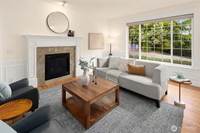 A wide, west-facing front window frames the leafy neighborhood beyond—bringing in abundant light and creating the perfect perch for a peaceful start to the day.