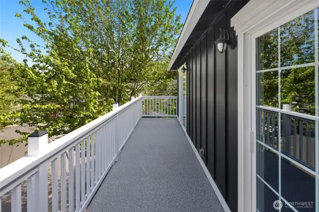 Step out from the upstairs landing or office to enjoy a peaceful moment viewing trees and water scenery from this private balcony.