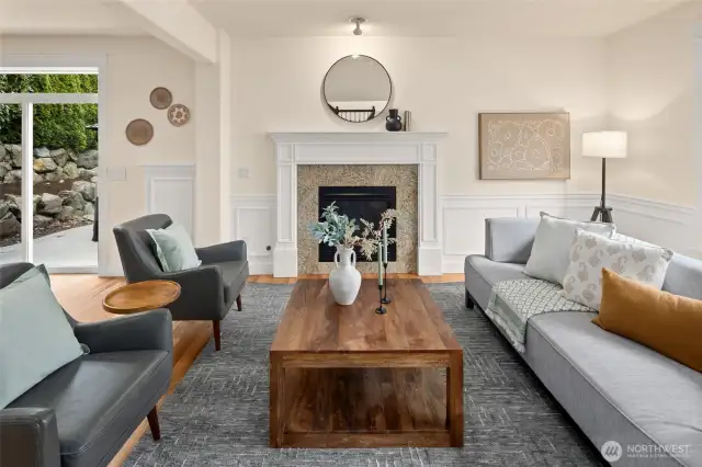 Details matter: crips wainscoting, gas fireplace, and a soft, neutral palette offer a sense of elegance that still feels like home.