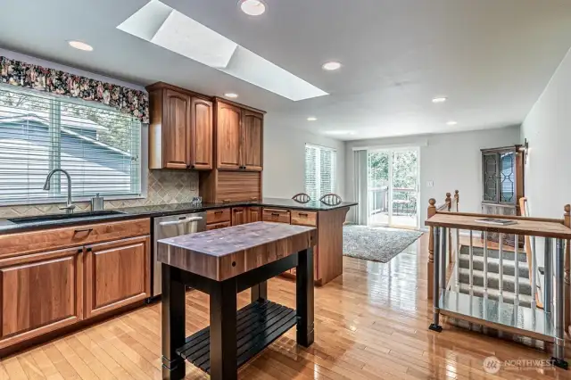 Kitchen with eating bar open to dining room