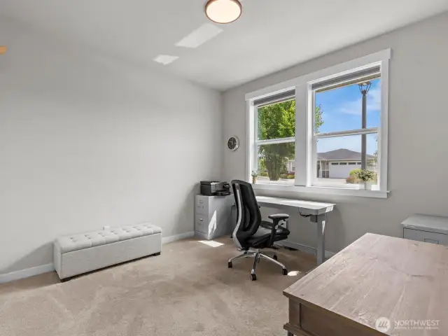 Immediately to your right is the 1st bedroom, perfect for a home office.