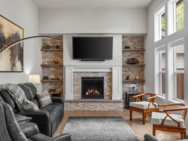 Custom stone wall around the fireplace really makes this space feel homey.