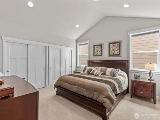 Double closets with gorgeous closet systems allow plenty of space for all of your wardrobe needs.