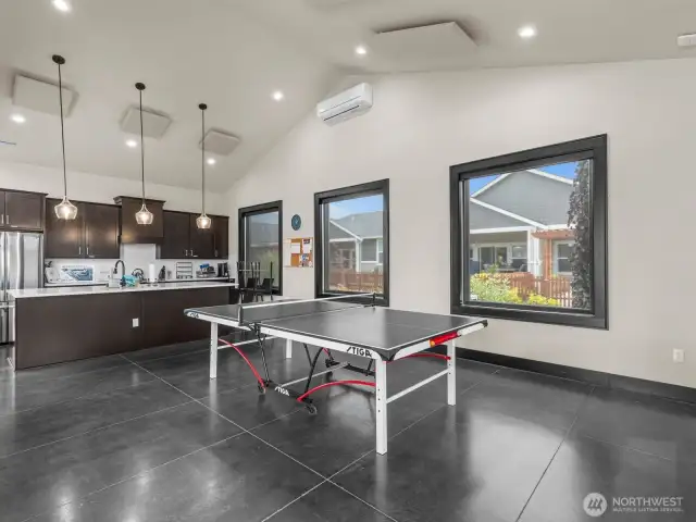 There's even a ping pong table that can be moved in and out. If you're cooking a giant feast and need more kitchen space, there's a full kitchen here too.