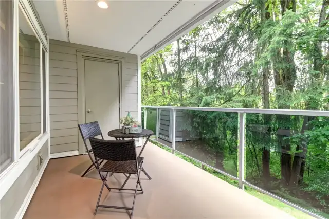 Large deck with additional storage and  overlooks greenspace