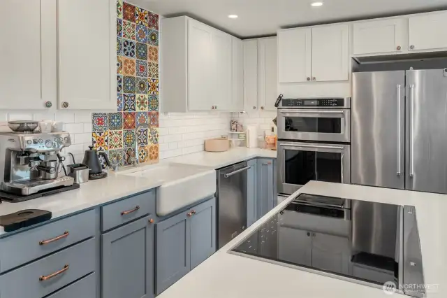 Gorgeous chef's kitchen with MSI Stone Stellar White Quartz countertops and Canyon Creek cabinets. Check out those stunning Mexican tiles!