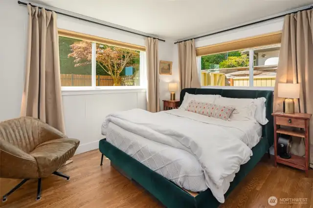Lower level primary with custom Hunter Douglas window shades.