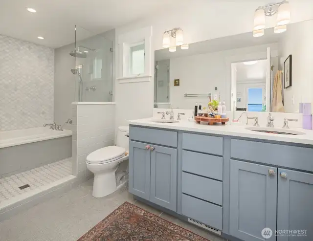 Calling this a "bathroom" is a disservice. The spa-like space, next to the primary bedroom, has a heated floor, double shower heads and sinks, exquisite tile work, imported ceramic sinks, and a HYDRO SYSTEM soaking tub. Learn about Hydro Fusion - https://hydrosystem.com/bath-tub-options/hydro-fusion/