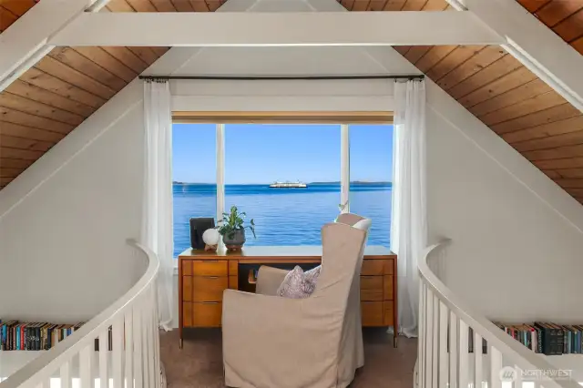 The captain's bridge overlooks the lower level from the landing adjacent to the loft bedroom. Watch the ferries and ships sail past from this perch. Be on the lookout for orca, seals, eagles and more. Imagine this as your home office!