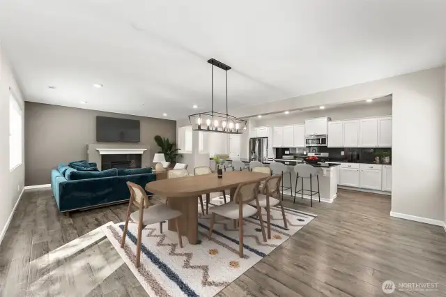 **Partially virtually staged** Open concept perfect for entertaining - dining room flows into kitchen and cozy living room.