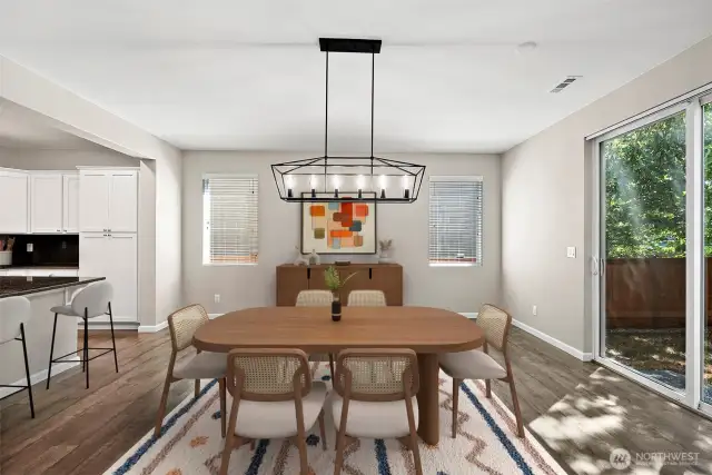 **Virtually Staged** Dining spot leads out to backyard through large sliding glass door.