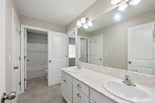 Jack and Jill bathroom vanity looking out to bedroom and hallway