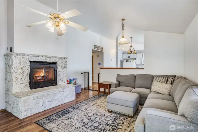 The beautiful fireplace serves as a stunning focal point adding warmth to the living space.