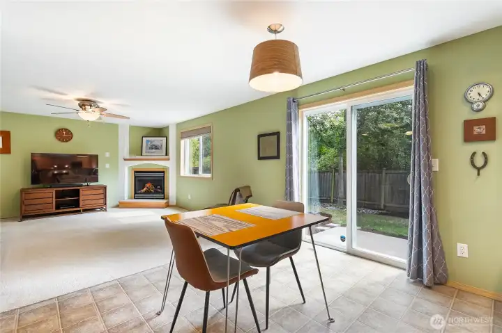The open kitchen/dining looks out to family room