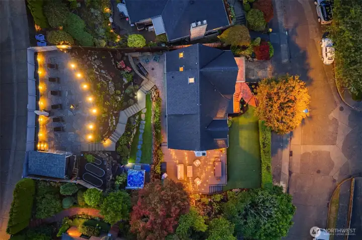 Gorgeous street to alley lot with custom lighting.  Can you find the hot tub?!?