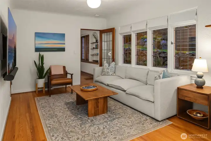 Bonus room on main level with wall of gorgeous leaded windows