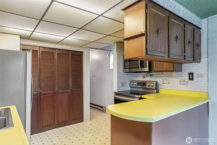 Kitchen with island and laundry closet