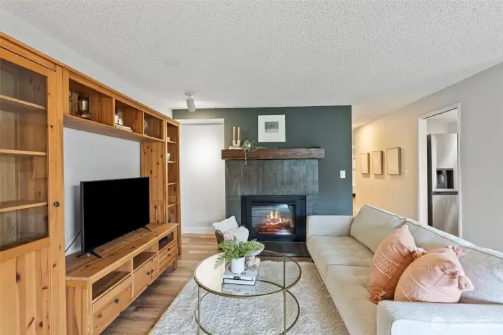 New tile surround and mantle on fireplace.