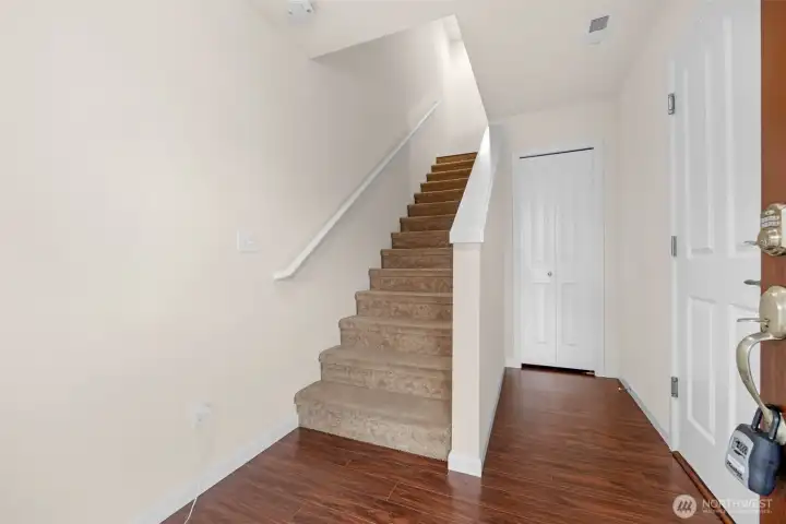 Front entryway with garage to right and storage closet