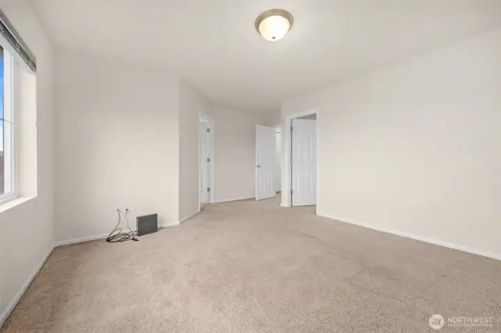 Primary bedroom walk in closet