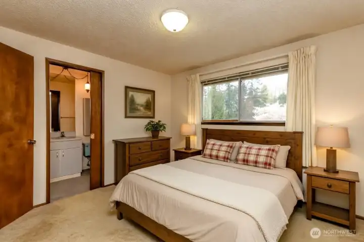 Virtually staged primary bedroom with ensuite.