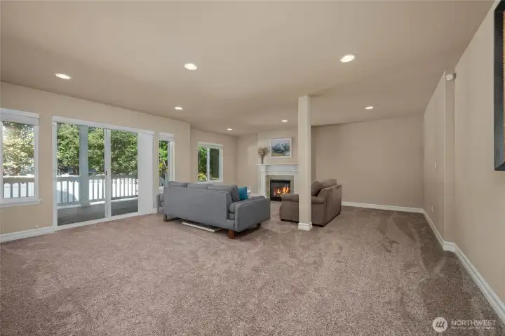Lower level great room leading to private backyard...