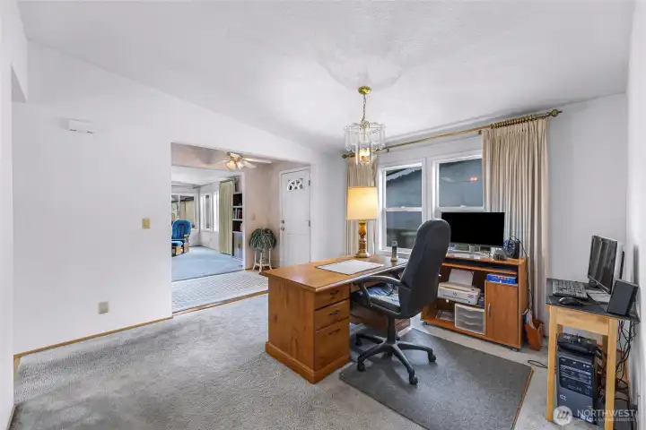 Versatile flex space with large windows and abundant natural light, ideal for a home office, den, hobby room, or secondary living area. Conveniently located just off the front entry for privacy and flexible everyday use