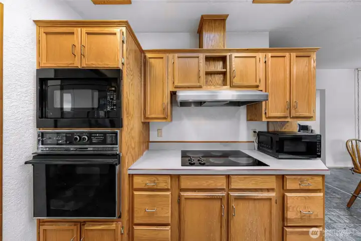 Thoughtfully designed kitchen offering excellent storage, convenient built-in appliances, and plenty of workspace for meal preparation
