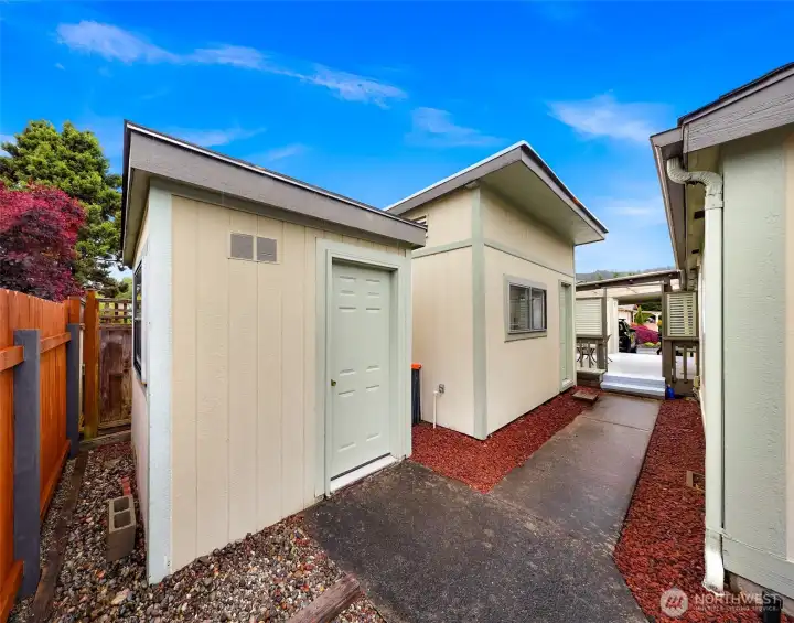 Separate storage/workshop space adds valuable flexibility and functionality with easy access from the covered deck and carport