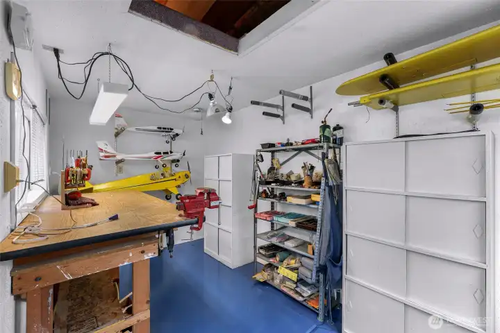 Dedicated workshop/hobby space offers excellent flexibility for woodworking, crafts, projects, or extra storage